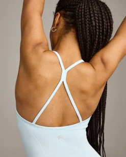 EnhanceLift™ Seamless Strappy Racer Vest with Built in Bra Shelf with Grey Logo