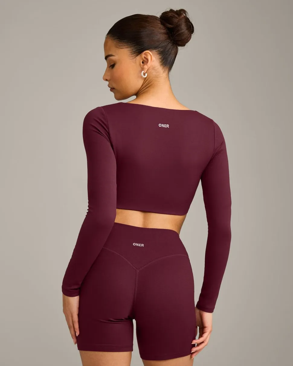 SoftMotion™ Scoop Neck Long Sleeve Crop Top with Built in Bra Shelf with Grey Logo
